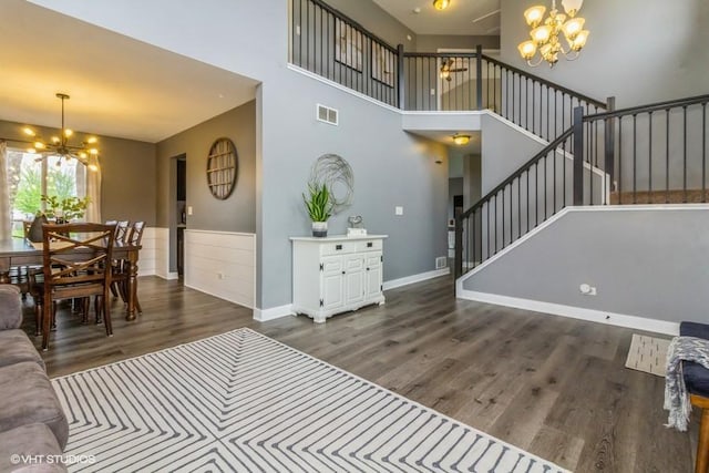 4524 Deames St, Plano, IL 60545 - living area featuring visible vents, stairs, wood finished floors, and a chandelier