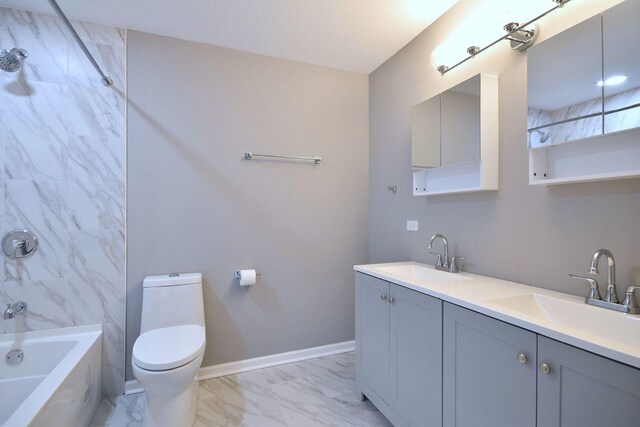 bathroom featuring a sink, toilet, double vanity, and marble finish floor