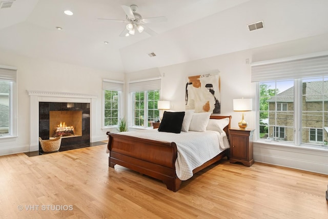 1238 N Illinois Ave, Arlington Heights, IL 60004 - bedroom with lofted ceiling, light wood-style flooring, a high end fireplace, and ceiling fan