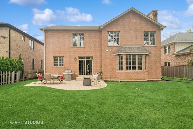 1238 N Illinois Ave, Arlington Heights, IL 60004 - back of property featuring brick siding, a patio, and a fenced backyard