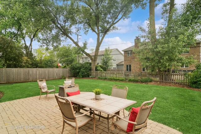 1238 N Illinois Ave, Arlington Heights, IL 60004 - fenced backyard with a patio area and outdoor dining space