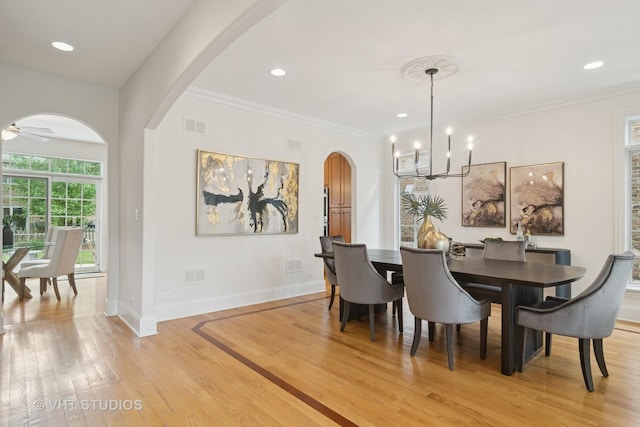 1238 N Illinois Ave, Arlington Heights, IL 60004 - dining room featuring arched walkways, light wood-style floors, a chandelier, ornamental molding, and recessed lighting