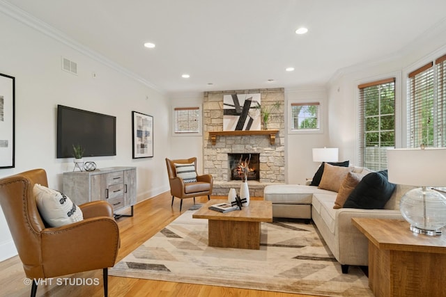 1238 N Illinois Ave, Arlington Heights, IL 60004 - living area with crown molding, light wood finished floors, a stone fireplace, and recessed lighting