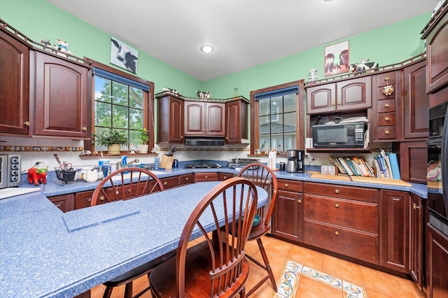 606 N Brainard Ave, La Grange Park, IL 60526 - kitchen with black microwave, light tile patterned floors, and recessed lighting