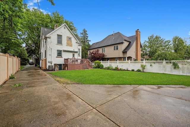 606 N Brainard Ave, La Grange Park, IL 60526 - rear view of property with a chimney, a deck, and stucco siding