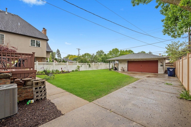 606 N Brainard Ave, La Grange Park, IL 60526 - view of yard featuring central air condition unit, an outbuilding, and a garage