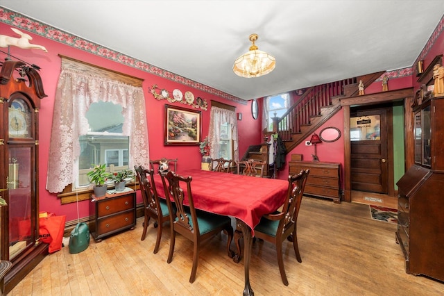 606 N Brainard Ave, La Grange Park, IL 60526 - dining room with a chandelier, wood finished floors, and stairs