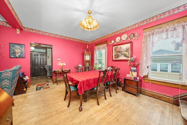 606 N Brainard Ave, La Grange Park, IL 60526 - dining room with a chandelier, hardwood / wood-style floors, and baseboards