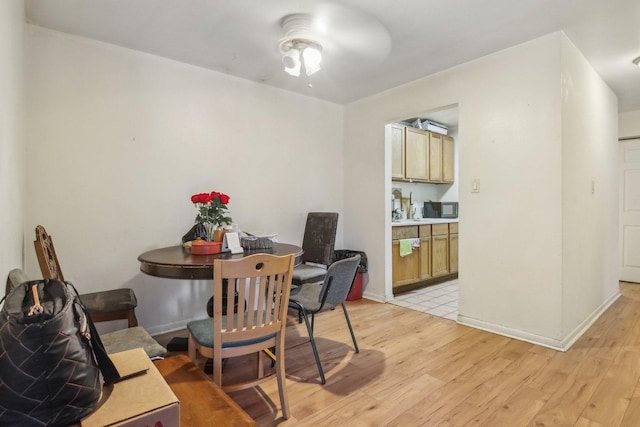 615 Hill Dr Unit 303, Hoffman Estates, IL 60169 - dining space featuring light wood finished floors, baseboards, and ceiling fan