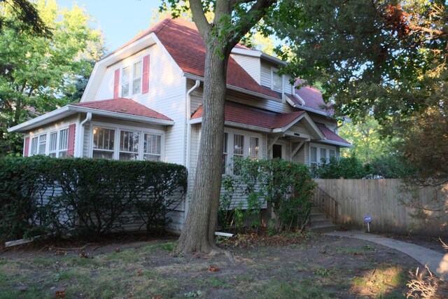 view of property exterior featuring fence