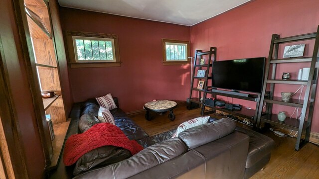 living room with baseboards and wood finished floors