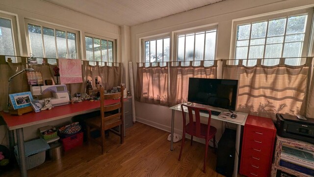 home office with wood finished floors