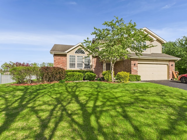 20359 Countryside Ln, Frankfort, IL 60423 - view of front facade with driveway, a front yard, a garage, brick siding, and fence