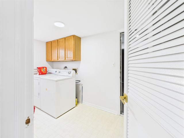 20359 Countryside Ln, Frankfort, IL 60423 - laundry room with light floors, cabinet space, baseboards, and washing machine and clothes dryer