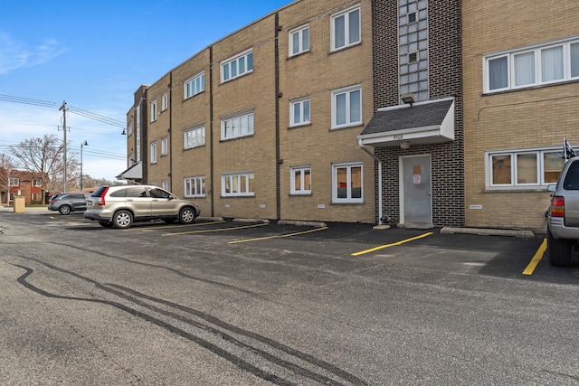 view of property featuring uncovered parking