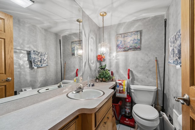 half bath featuring toilet, tile patterned flooring, and vanity
