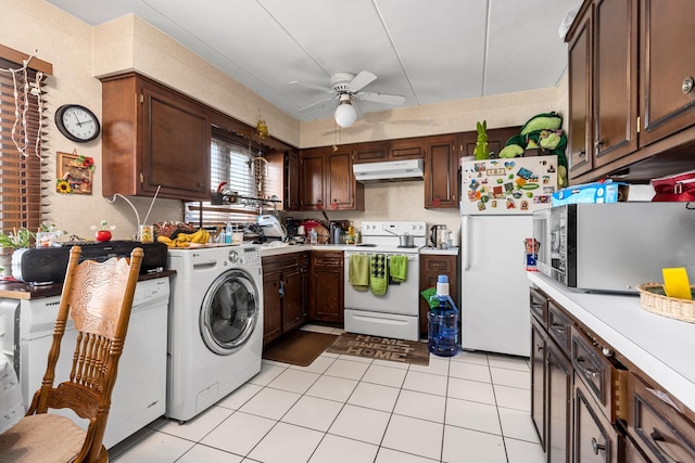 kitchen with a ceiling fan, light countertops, washer / dryer, under cabinet range hood, and white appliances