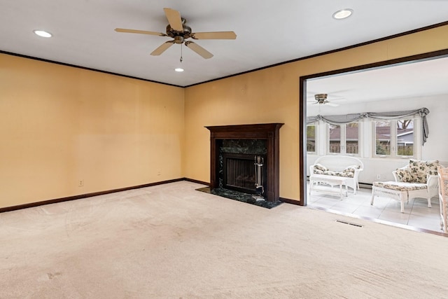 unfurnished living room with crown molding, carpet floors, a ceiling fan, and visible vents