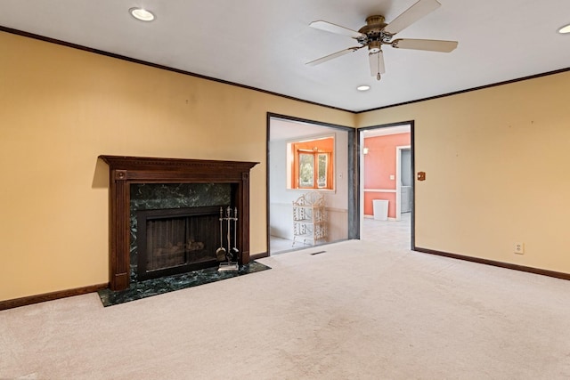 unfurnished living room featuring baseboards, carpet flooring, recessed lighting, and ornamental molding