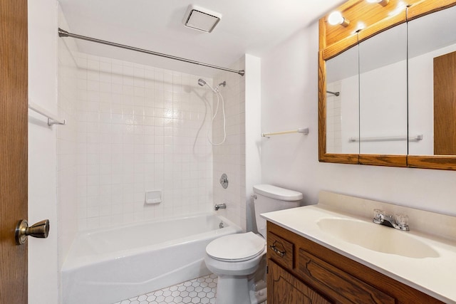full bath with vanity, shower / tub combination, tile patterned flooring, and toilet