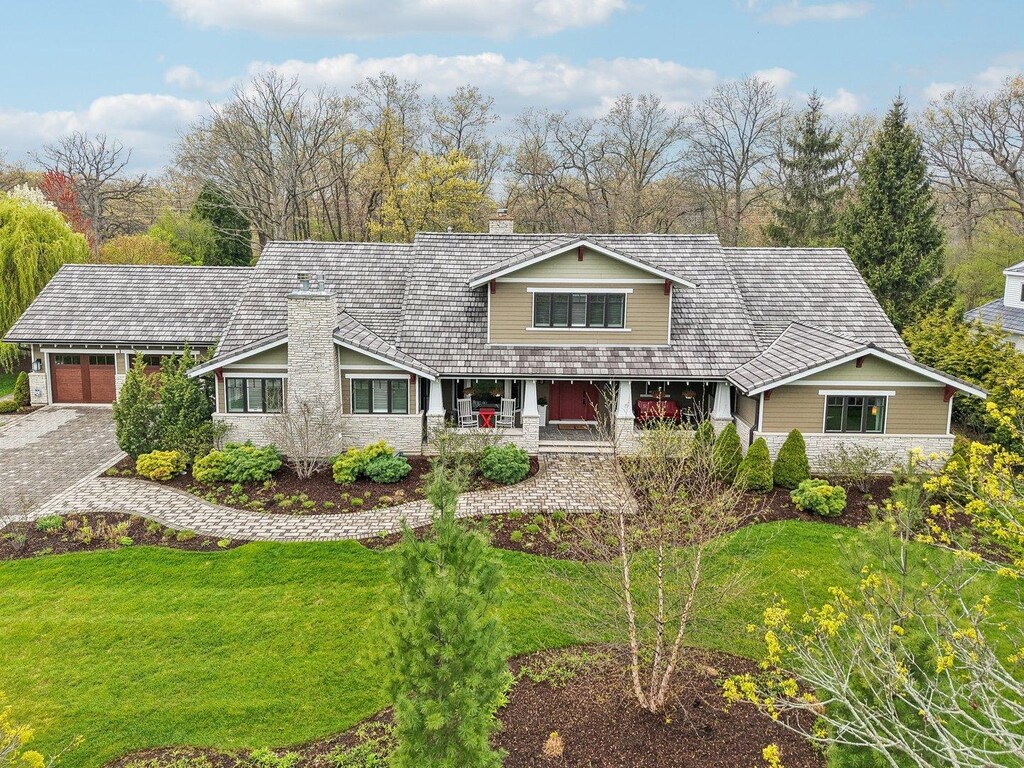 598 Rockefeller Rd, Lake Forest, IL 60045 - view of front of home with a chimney, a front lawn, an attached garage, and decorative driveway