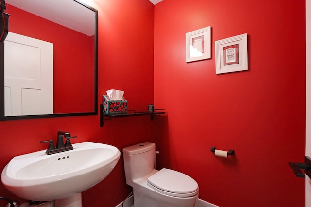 bathroom featuring toilet and a sink
