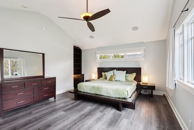 bedroom with dark wood finished floors, baseboards, high vaulted ceiling, and a ceiling fan