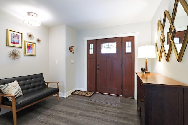 entryway with dark wood finished floors and baseboards