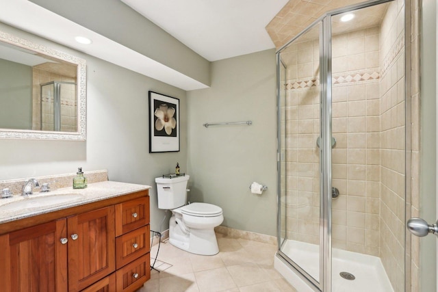 bathroom featuring a stall shower, tile patterned floors, vanity, and recessed lighting