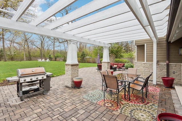 view of patio with a pergola, grilling area, and outdoor dining area