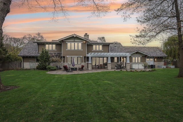 back of property with a pergola, stone siding, a chimney, a patio, and central air condition unit