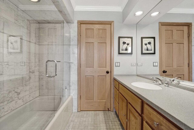full bathroom featuring recessed lighting, enclosed tub / shower combo, ornamental molding, and vanity