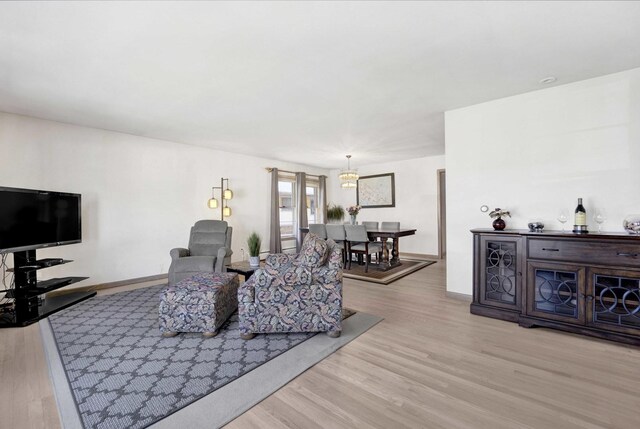 living room featuring baseboards and wood finished floors
