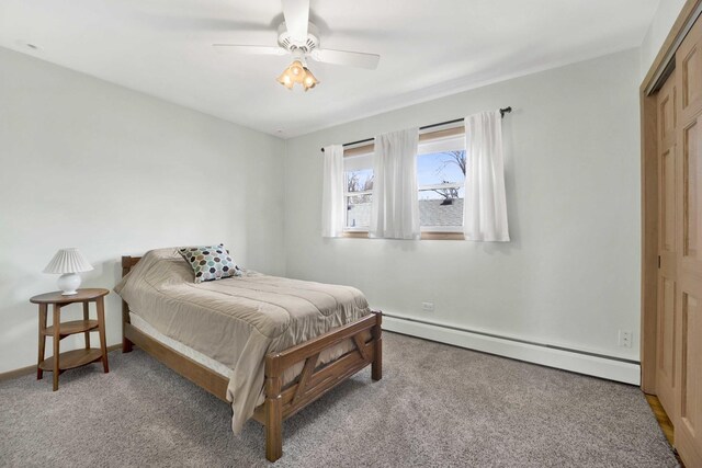 bedroom featuring baseboards, a baseboard radiator, ceiling fan, and light carpet