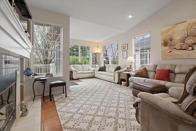 living room featuring light wood-style floors, recessed lighting, and lofted ceiling