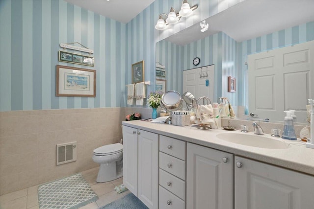 bathroom featuring tile patterned floors, toilet, wallpapered walls, and visible vents