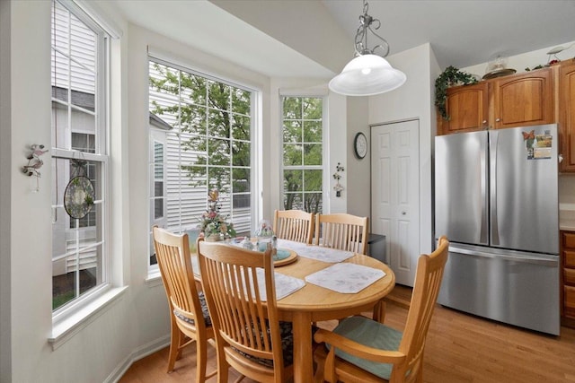 dining area with light wood-style floors