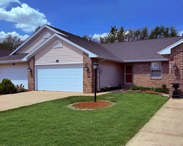 ranch-style house featuring brick siding, an attached garage, and driveway