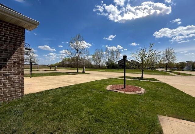 surrounding community featuring a yard