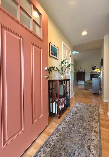 interior space featuring recessed lighting, baseboards, and light wood-style floors