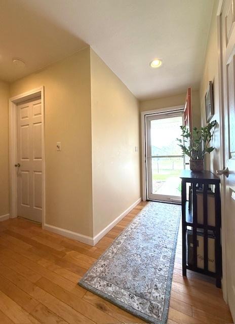 entryway featuring recessed lighting, baseboards, and light wood-type flooring
