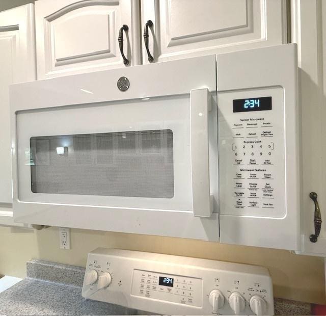 room details featuring white microwave