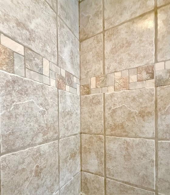 room details with a tile shower