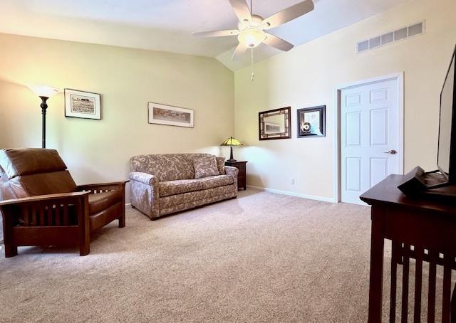 living room featuring ceiling fan, visible vents, vaulted ceiling, baseboards, and carpet flooring