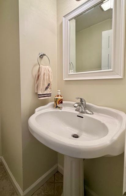 bathroom featuring tile patterned floors and baseboards