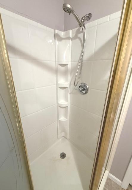 bathroom with a stall shower