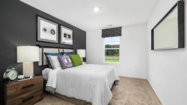 carpeted bedroom featuring baseboards and recessed lighting