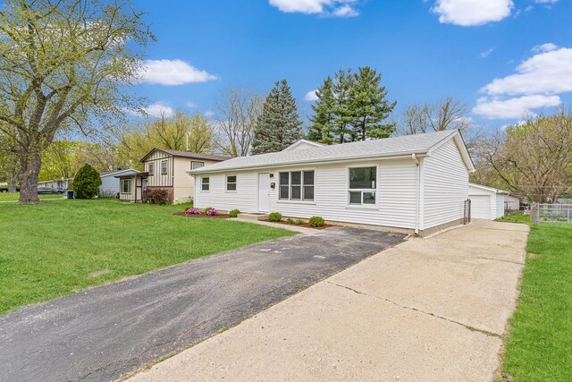 18624 W Pamela Pl, Gurnee, IL 60031 - view of front of property featuring an outdoor structure, a garage, a front lawn, and a shingled roof