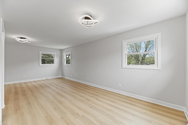 18624 W Pamela Pl, Gurnee, IL 60031 - unfurnished room with baseboards and a wealth of natural light