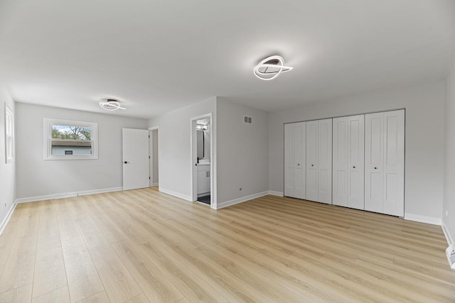18624 W Pamela Pl, Gurnee, IL 60031 - unfurnished bedroom featuring baseboards, visible vents, and light wood finished floors